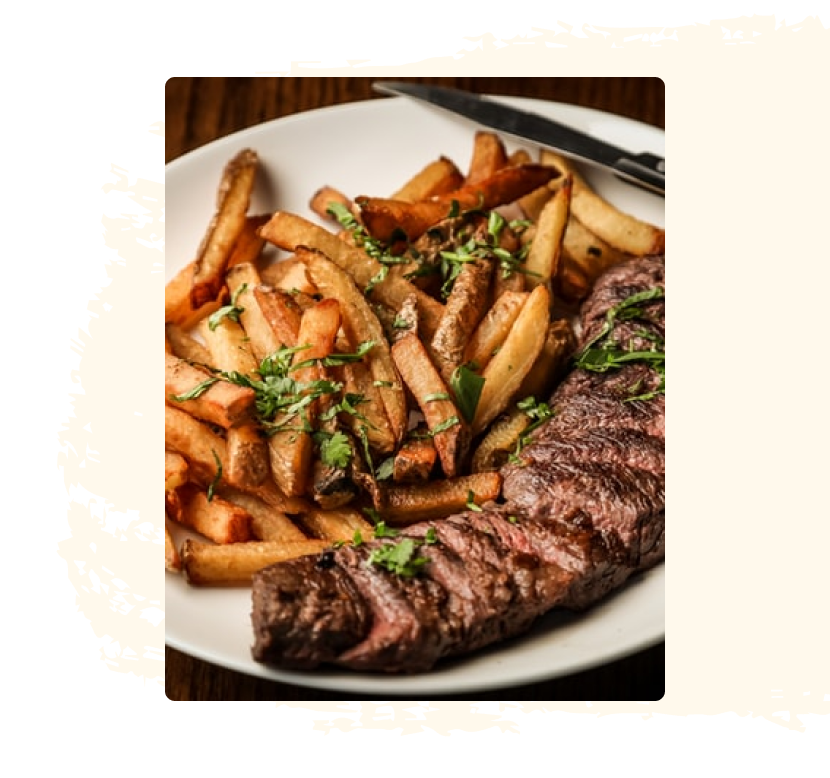 a plate of fries and steak